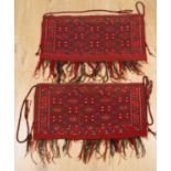 A pair of antique Yomut Turkoman Torbas each with a red ground diamond motif, with red and green