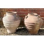 A pair of Greek style terracotta storage jars each with three looping handles, 46cm diameter x