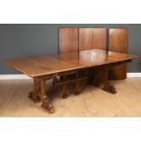 A French late 19th / early 20th century walnut extending dining table with carved decoration