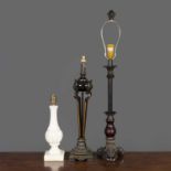 Two Empire style table lamps with ebonised metal bases with gilt edged foliate decoration, one