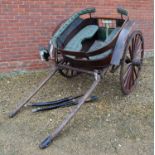 An early 20th century horse's gig approximately 165cm wide including wheels x 245cm in length,