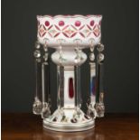 A large antique bohemian layered cranberry glass luster with twelve cut glass drops, 25cm diameter x