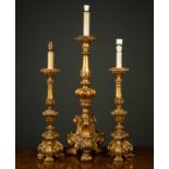 A large gilded plaster table lamp of classical scrolling form with acanthus leaf decoration, with