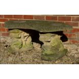 A reconstituted stone garden bench with curved top and fish supports, 106cm wide x 42cm