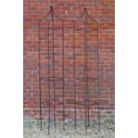 A pair of wrought iron square sectional obelisks the pointed top terminating in a ball finial,