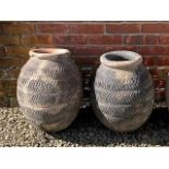 A near pair of antique Mediterranean terracotta round bottomed storage jars each 38cm wide x 52cm