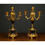 A pair of late 19th century ormolu and turned black hardstone four branch candelabra each 22cm
