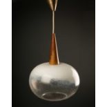 A continental hanging ceiling light, the clear and white glass squashed sphere topped by wooden