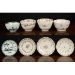 A group of four New Hall tea bowls and saucers, three with floral and foliate decoration, the fourth