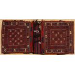 An early 20th century Afshar Khorjin saddle bag with a red and blue ground and geometric decoration,
