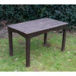 A brown painted hardwood garden table with chamfered square supports, 117cm wide x 71cm