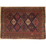 An antique Afshar Soumak red and blue ground rug with twelve central diamond motifs and a multiple