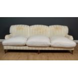 A Howard style triple upholstered settee 244cm wide x 96cm deep x 40cm high at the seat x 83cm