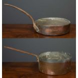 A copper saucepan with wrought iron handle, possibly from Blenheim Palace, the outer rim stamped