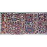 An antique Turkish Kelim with polychrome geometric decoration, 384cm x 185cm From the collection