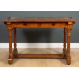 A Victorian and later walnut side table by Gillow & Co, with brass galleried top, two drawers, on