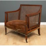A Regency mahogany campaign seat with caned removable back and arms, and inset upholstered seat,