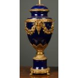 A cobalt blue glazed porcelain lamp of baluster form with gilt mounts, 28cm wide x 49cm high