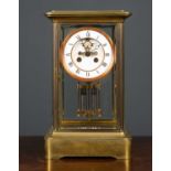 A 19th century French four glass mantle clock the two pair dial with visible escapement and the