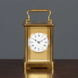 A 20th century brass carriage clock the white enamelled dial marked with roman numerals within