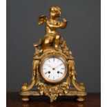 A gilt Spelter mantle clock, possibly French, topped with a figure of a cherub covered in