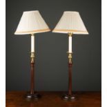 A pair of Georgian style mahogany table lamps with gilt metal candle sconce on mahogany pillar and