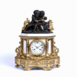 Martin Baskett et Cie, Paris Clockmaker. An ormolu and white marble mantel clock, the enamel dial