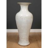 A large porcelain vase of baluster form with a flaring rim, having an iridescent, silver and white