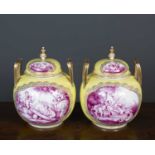 A pair of continental yellow ground porcelain jars and covers with gilt tooled handles and