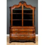 An 18th century Dutch marquetry inlaid display bombe cabinet the ribbon tied floral decorated