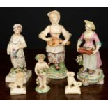 A collection of ceramic figurines, comprising 3 female figures, one playing the hurdy gurdy, 16cm