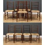 A set of eight early 20th century William Morris style chairs with turned supports and rush seats,