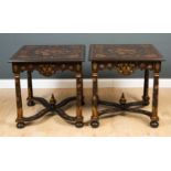 A pair of ebonised and painted square topped tables with turned supports united by a stretcher, 71cm
