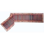 An antique Hamadan runner the central blue ground with a banded border and repeated decoration, 75cm