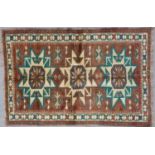 A Turkish Kars cream, brown and green ground woollen rug 148cm x 214cmCondition report: In good