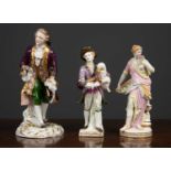 Two 19th century continental porcelain figurines marked KPM to the bottom; a bagpipe player on a