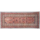 An early 20th century North West Persian Malayer rug with central rosettes and a multiple banded