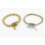 Two Victorian gilt metal bracelets, the first of snake-link design, suspending two blue enamel and