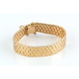 A yellow precious metal fancy-link bracelet, of articulated honeycomb-link design, stamped '18K',