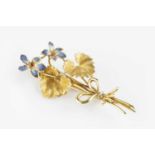 An enamel floral spray brooch, modelled as a spray of two blue, white and red enamel flowerheads,