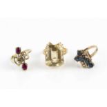 Three gem set dress rings, comprising a sapphire and diamond dress ring, of abstract geometric