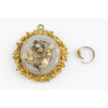 A 19th century pendant/brooch, centred with a circular chalcedony panel with faceted border, applied