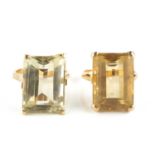 Two citrine single stone dress rings, each with a rectangular step-cut citrine in four claw setting,