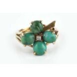 A turquoise and diamond dress ring, modelled as a shamrock, the oval cabochon turquoises enclosing a
