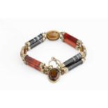 A Victorian hardstone panel bracelet, designed as a series of carnelian and banded agate batons with