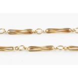 A 9ct gold fancy-link chain, designed as a series of twisted baton links, with Sheffield import