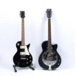 A 'Vintage' bass guitar, the ebonised body with ivorine string line decoration, 98.5cm overall;