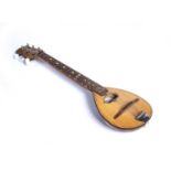 A Russian folk lute(?) with spruce body and attached label printed in cyrillic, 55cm overall