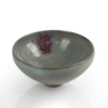 Junyao bowl Chinese, Jin/Yuan dynasty covered in a crackle glaze with a red copper splash near the