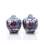Miniature pair of globular vases Chinese, Qing dynasty decorated in cobalt blue, depicting figures